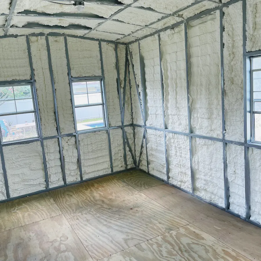 Closed-cell spray foam insulation applied to wall cavities in a residential project in Poolesville